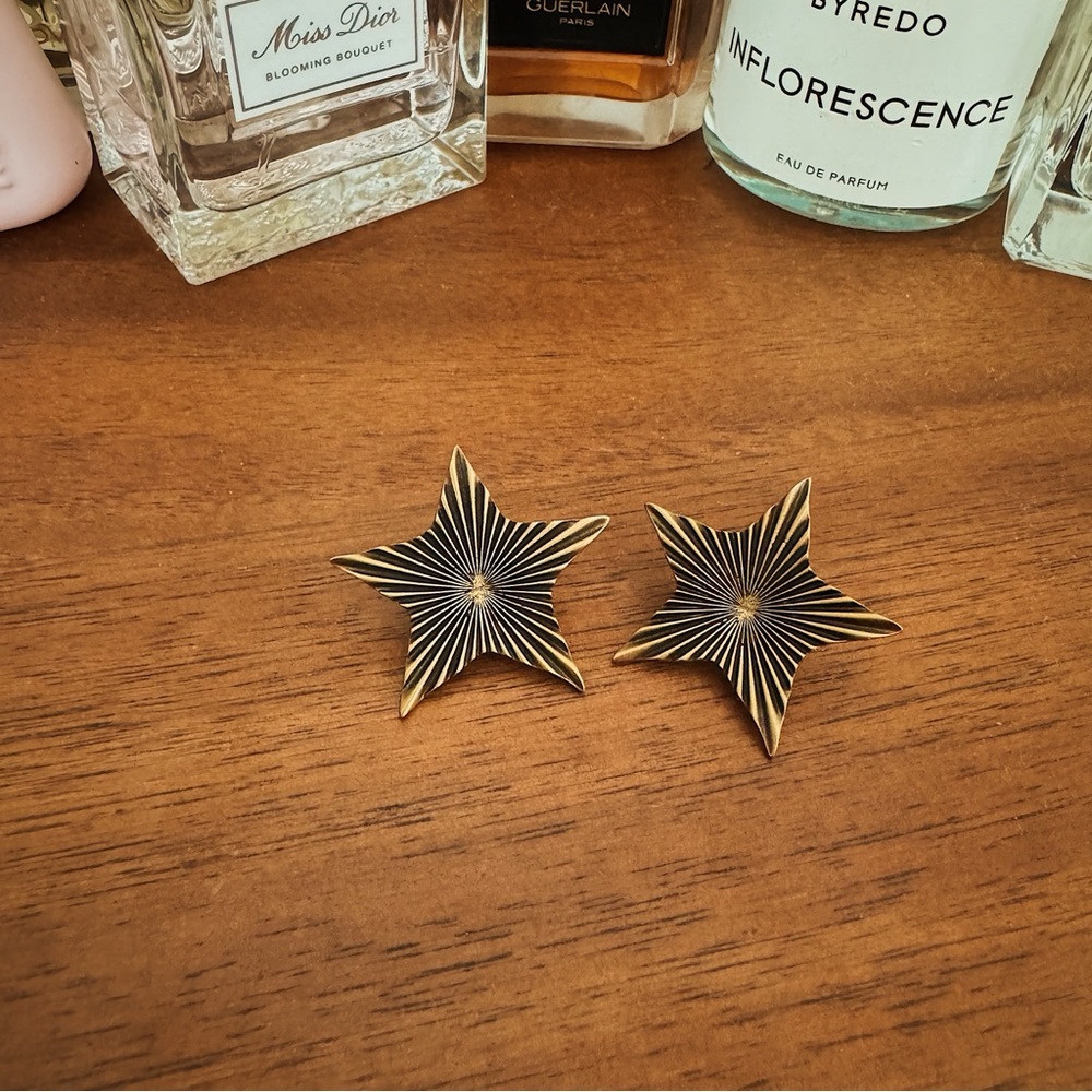 YSL Antiqued Gold Toned Star Earrings
